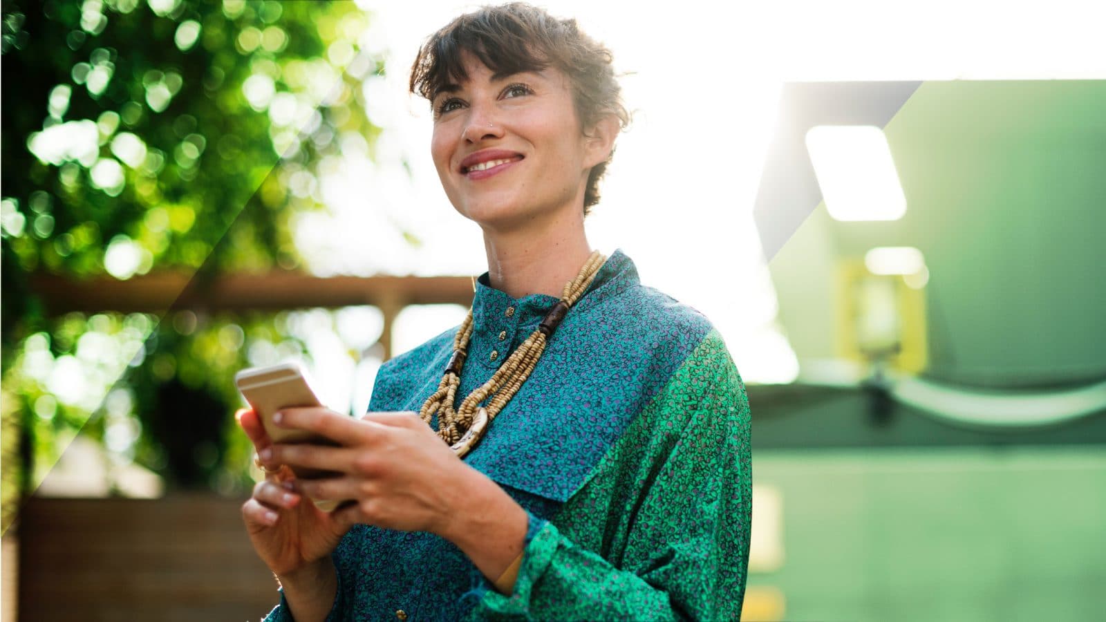 A woman with her phone outdoors