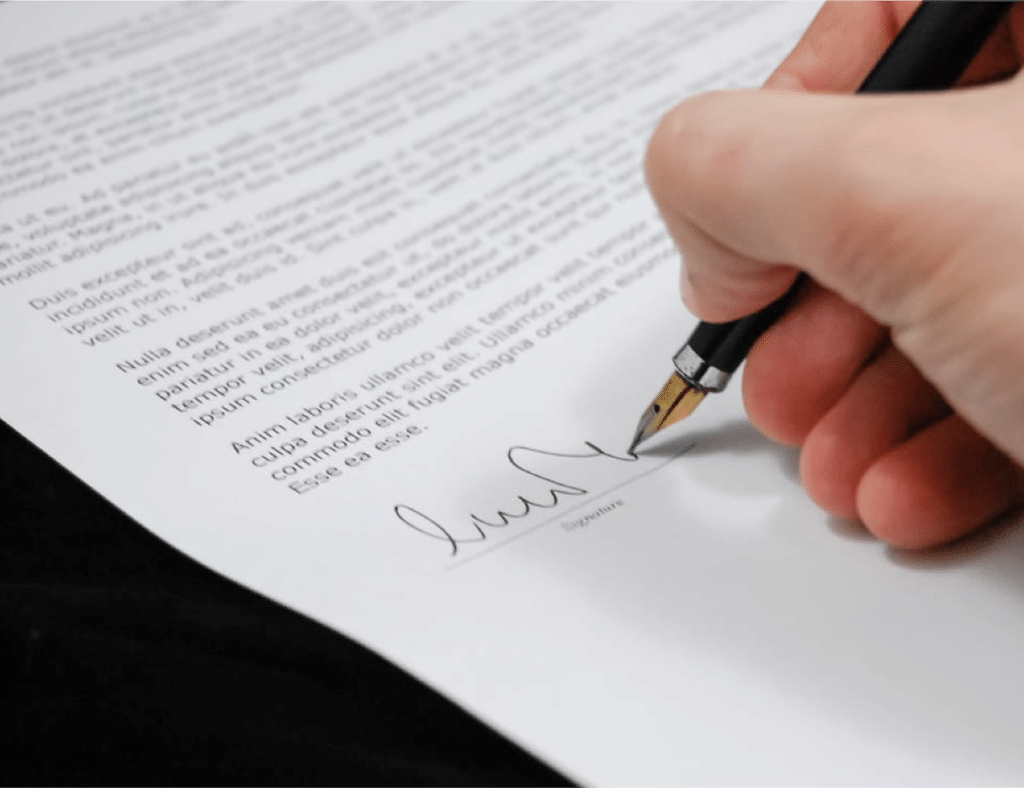 Person Signing a Document Close-up